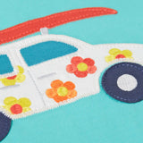 Close up of Frugi's 100% organic cotton short sleeve t-shirt in light blue showing white with flowers car patch detail