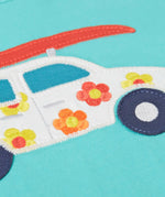 Close up of Frugi's 100% organic cotton short sleeve t-shirt in light blue showing white with flowers car patch detail