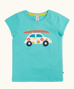 Frugi 100% organic cotton short sleeve t-shirt in light blue with white car patch carrying a surfboard on the front