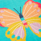 Close up of large butterfly embroidery on Frugi's 100% organic cotton cardigan in light blue 