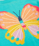 Close up of large butterfly embroidery on Frugi's 100% organic cotton cardigan in light blue 