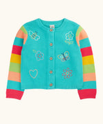 Frugi 100% organic cotton cardigan in light blue with rainbow striped sleeves and spring inspired embroideries on front. Showing full length front button fastener