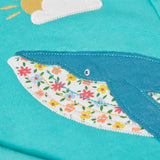 Close up of the whale patch on the Frugi 100% organic cotton carbis hoody in blue 