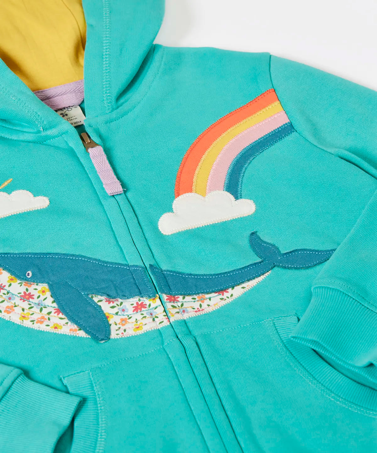 Frugi 100% organic cotton carbis hoody in blue with yellow inner lining laid flat showing the whale patch and front zip