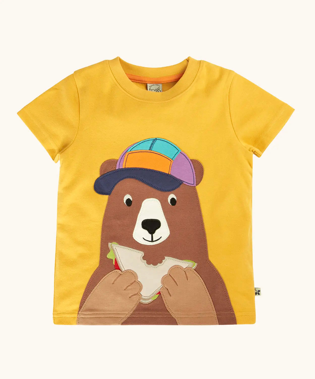 Frugi 100% organic cotton yellow short sleeve t-shirt with a playful brown bear eating a sandwich patch on the front