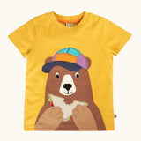 Frugi 100% organic cotton yellow short sleeve t-shirt with a playful brown bear eating a sandwich patch on the front