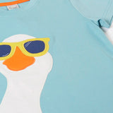 Frugi 100% organic cotton short sleeve t-shirt in light blue laid flat showing  a playful white goose wearing sunglasses patch on the front