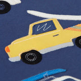 Close up of a yellow vehicle patch on the Frugi 100% organic cotton navy short sleeve t-shirt 