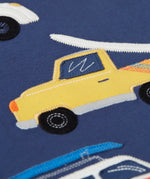 Close up of a yellow vehicle patch on the Frugi 100% organic cotton navy short sleeve t-shirt 