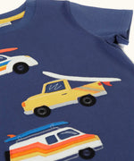 Frugi 100% organic cotton navy short sleeve t-shirt laid flat showing repeating summer inspired vehicle patches on the front