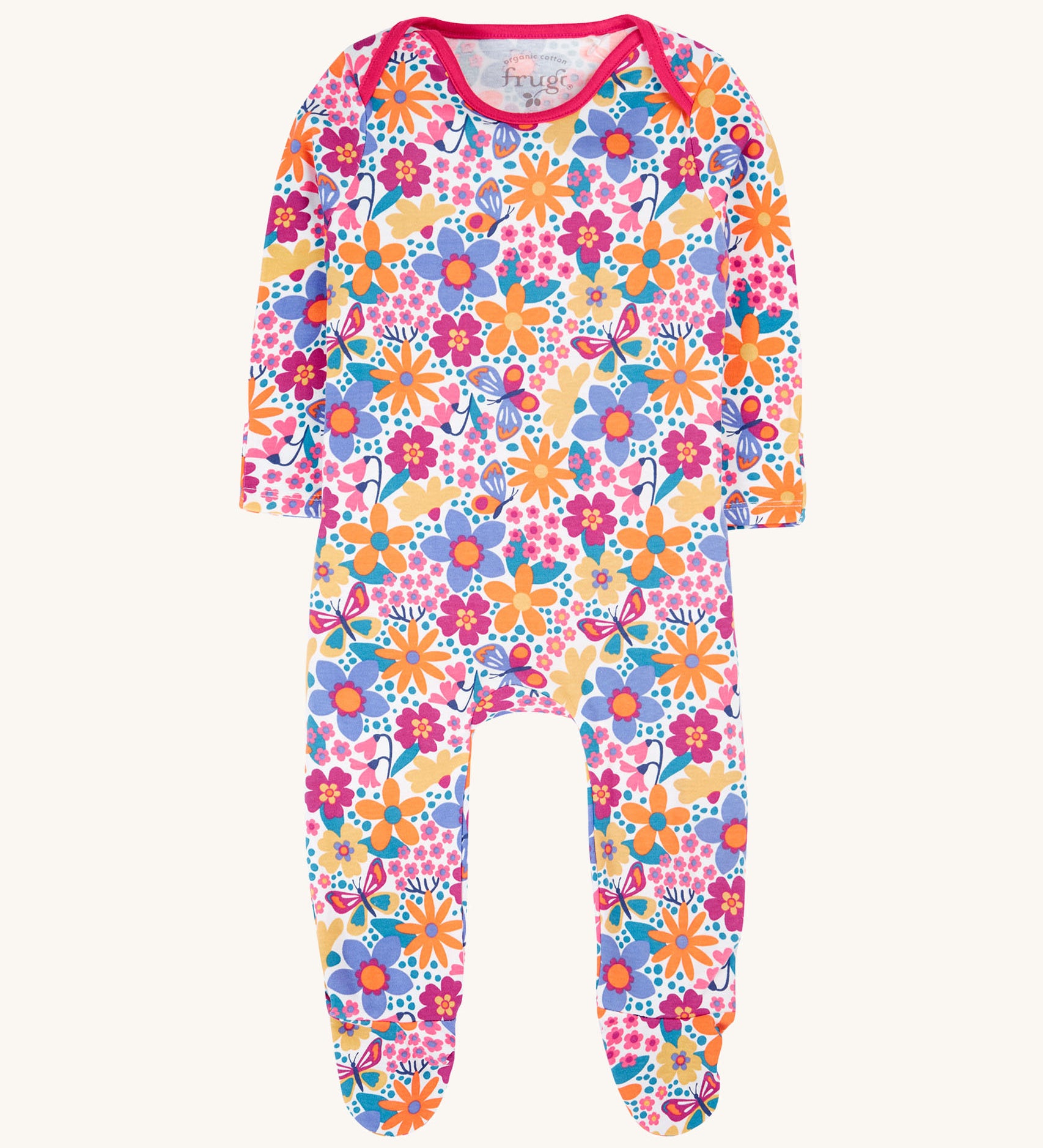 Frugi easy dressing printed babygrow in white/retro floral design available at Babipur. A GOTS organic cotton all in one with a bright retro floral design and pink trim around the neck and shoulder.