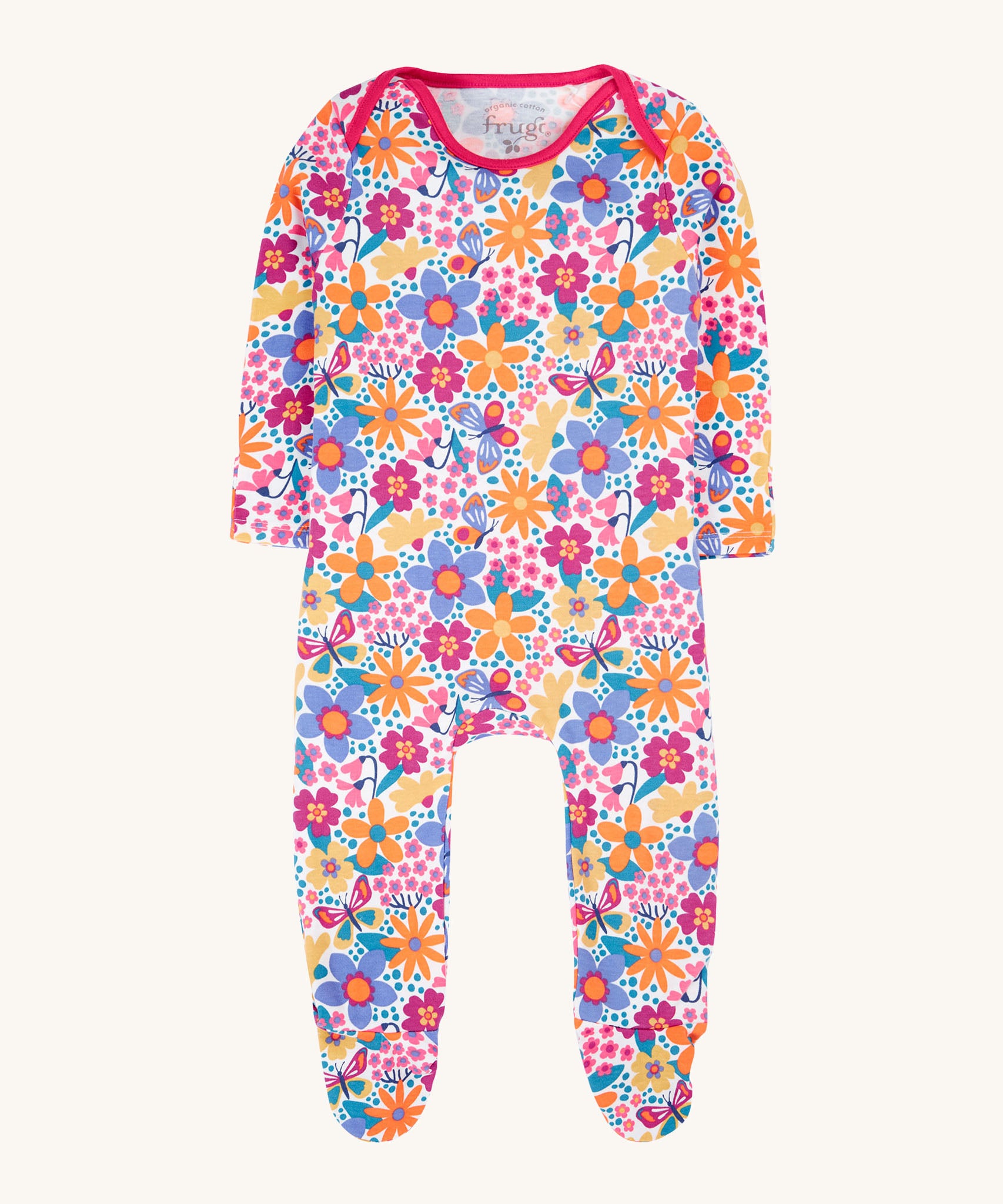 Frugi easy dressing printed babygrow in white/retro floral design available at Babipur. A GOTS organic cotton all in one with a bright retro floral design and pink trim around the neck and shoulder.