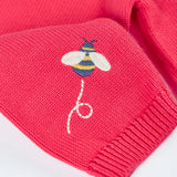 Close up of bee embroidery on the sleeve of the Frugi 100% organic cotton Ella cardigan in pink 