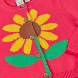 Frugi 100% organic cotton Ella cardigan in pink laid flat showing sunflower design on the front and button fasteners