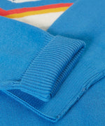 Close up of the Frugi 100% organic cotton Elwood knitted jumper in blue showing a turned up cuff