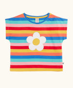 Frugi 100% organic cotton short sleeve Fiona t-shirt in rainbow stripes with a white daisy patch on the front