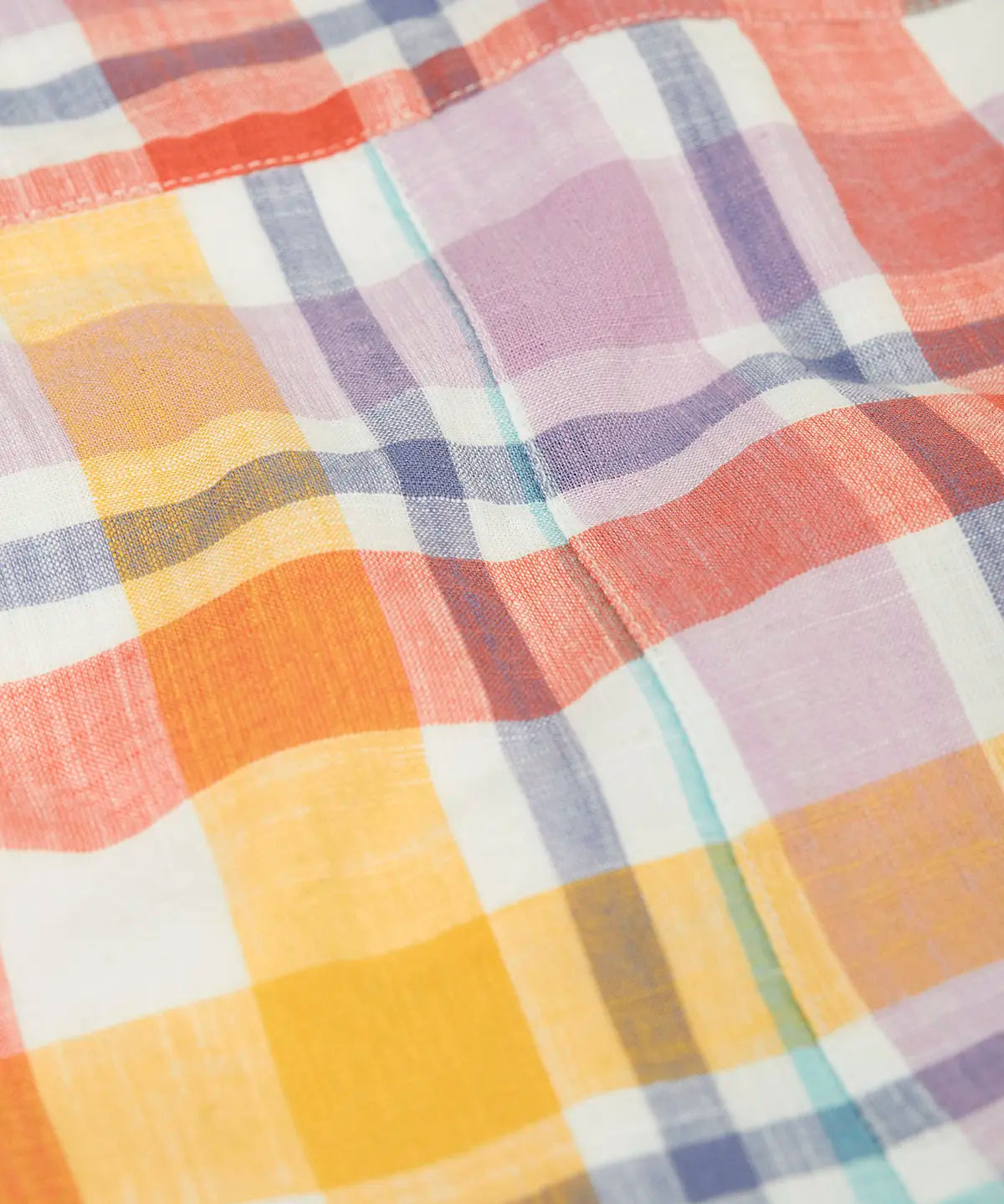 Close up of the pastel check design on the Frugi 100%  organic cotton dungarees.