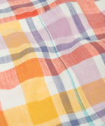 Close up of the pastel check design on the Frugi 100%  organic cotton dungarees.