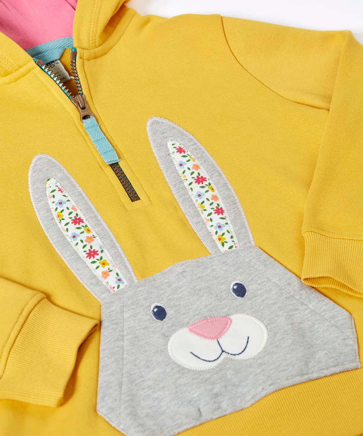 Frugi 100% organic cotton yellow hoodie laid flat. Showing half length front zip and rabbit patch pocket 