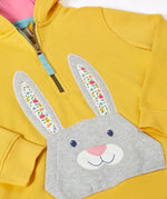 Frugi 100% organic cotton yellow hoodie laid flat. Showing half length front zip and rabbit patch pocket 