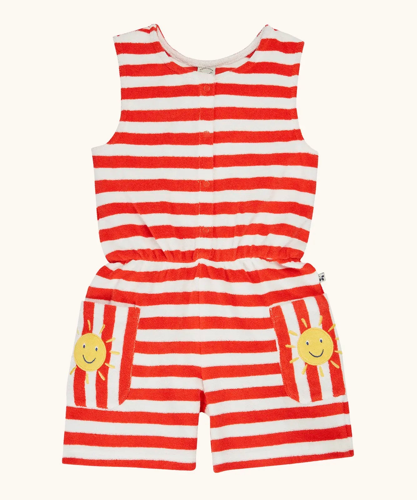 Frugi 100% organic cotton Harlyn towelling playsuit in red and white stripes. Showing wide pockets with a smiling sun patch.