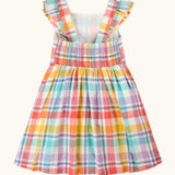 Frugi springtime dress in pastel check with frilled shoulders and elasticated back panel