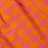 Close up of the Frugi 100% organic cotton Kai shorts showing the orange and pink check detail