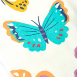 Close up of the repeating butterfly print on the Frugi 100% organic cotton Kernow pyjama set 