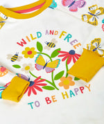 Frugi 100% organic cotton pyjama top  in white showing  a repeating butterfly print on the sleeves and a large wild and free floral design on the front