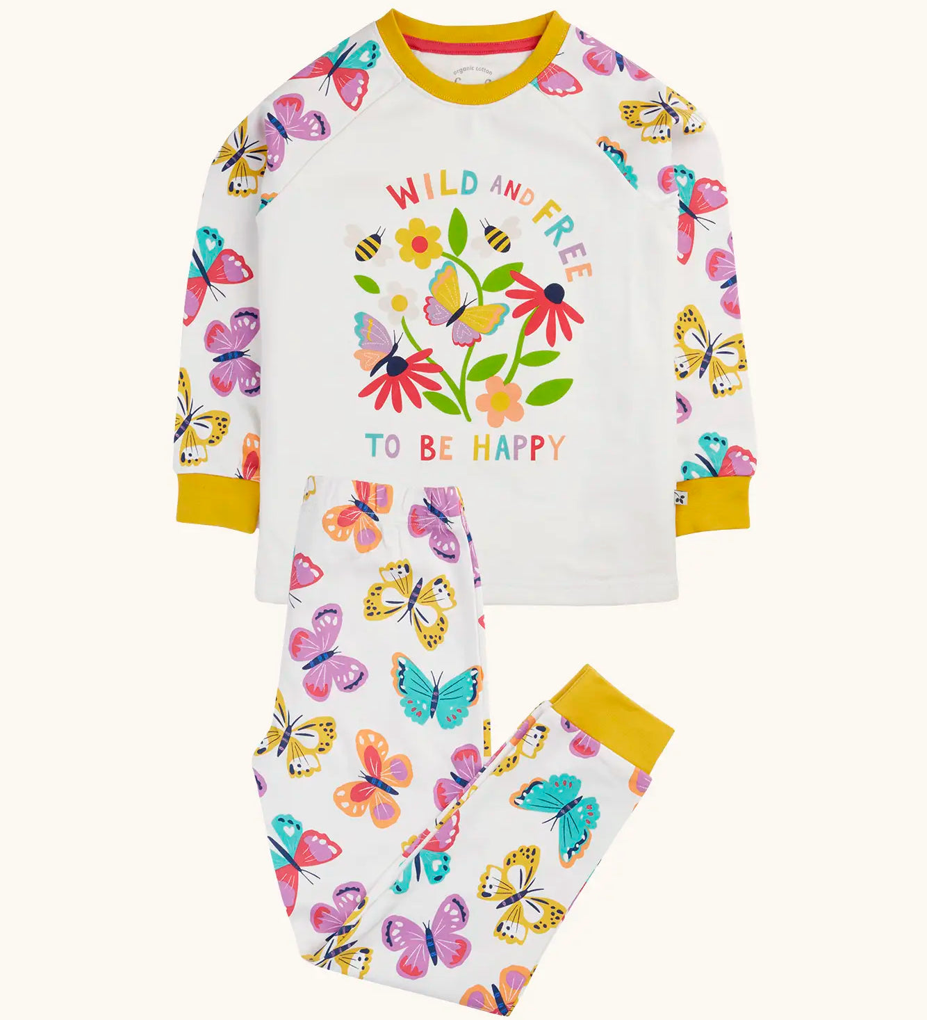 Frugi 100% organic cotton pyjama set in white showing  a repeating butterfly print on the trousers and large wild and free flower design on the top