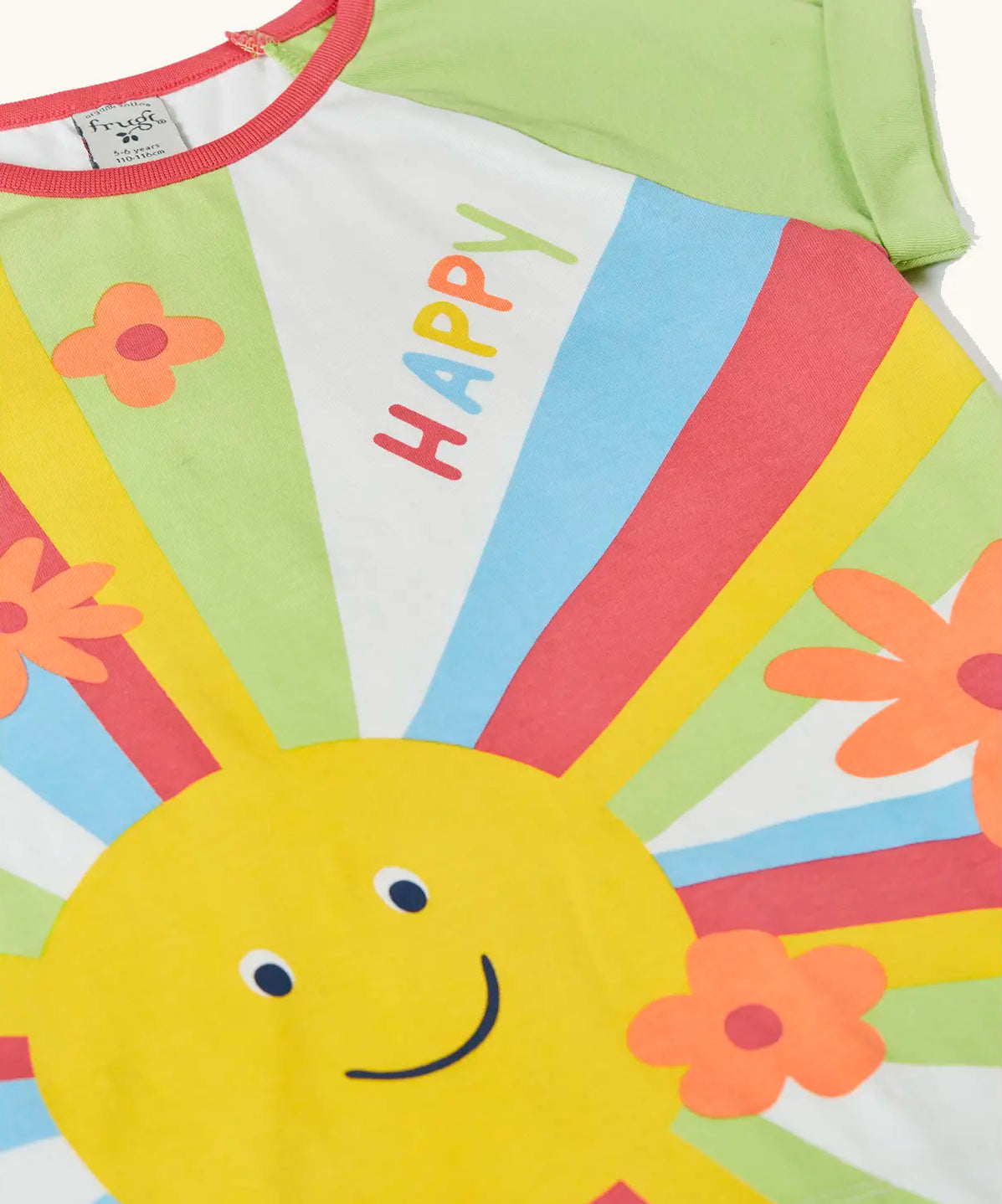 Frugi 100% organic cotton light green raglan short sleeve t-shirt laid flat showing the large sun print on the front with flowers and happy slogan.