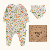 Frugi 100% organic cotton lovely gift set including a white babygrow with a repeating meadow inspired print, matching bib