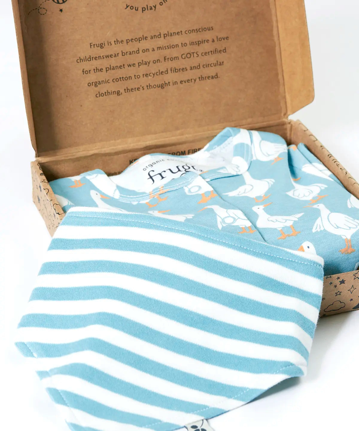 Frugi 100% organic cotton light blue baby grow with repeating white geese and a blue and white striped bib presented in a decorated box