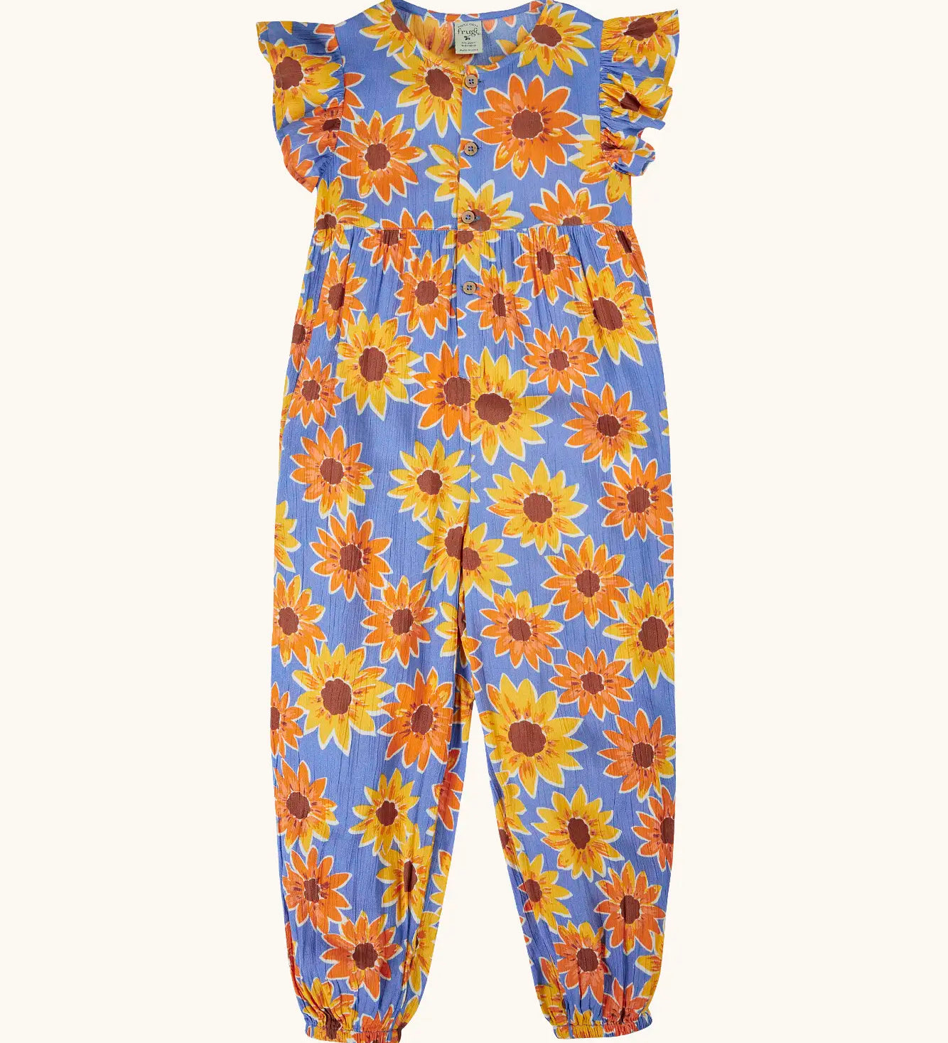 Frugi Lowenna jumpsuit in purple with a repeating sunflower print. Showing frilled shoulder and elasticated leg cuffs