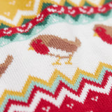A close up of the robin on the Frugi lumi knitted festive romper fair isle available at Babipur. A GOTS organic cotton soft knitted all in one in a fairisle design with robins. Features button fasteners running down from the shoulder.