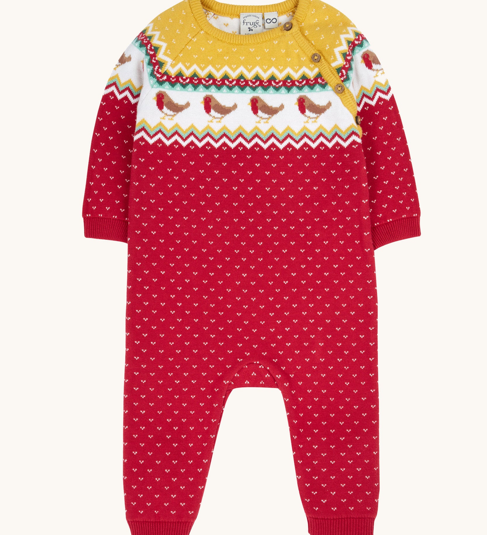 Frugi lumi knitted festive romper fair isle available at Babipur. A GOTS organic cotton soft knitted all in one in a fairisle design with robins. Features button fasteners running down from the shoulder.