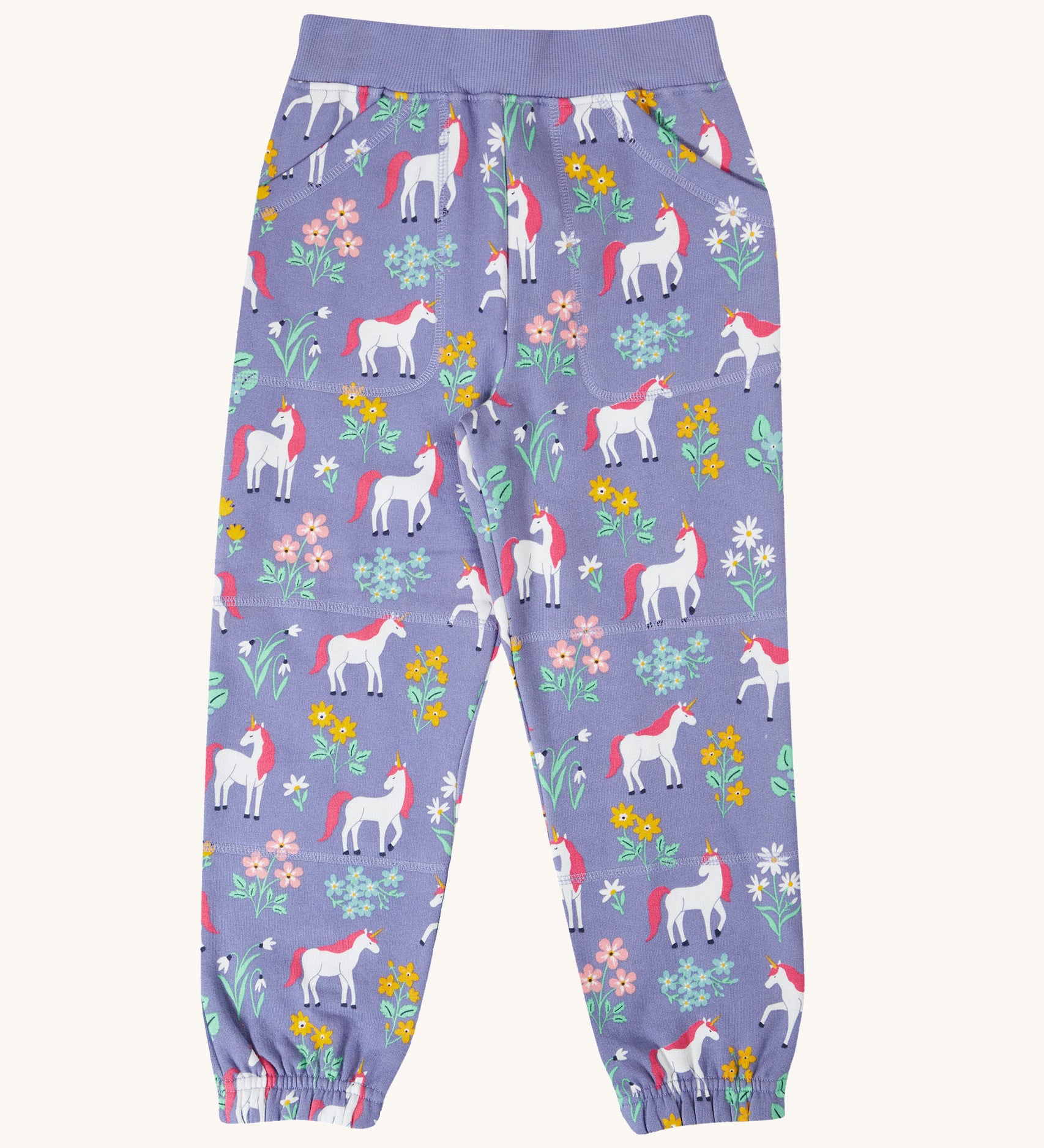 Frugi malpas joggers in unicorn / floral available at Babipur. A GOTS organic cotton jogger in light purple with a playful unicorn and floral design. Features elasticated cuffs and side pockets