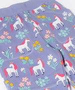 A close up of the pockets and the waistband on the Frugi malpas joggers in unicorn / floral available at Babipur. A GOTS organic cotton jogger in light purple with a playful unicorn and floral design. Features elasticated cuffs and side pockets
