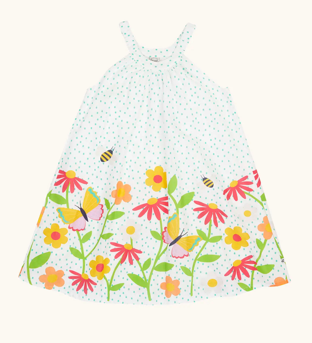 Frugi 100% organic cotton twirly dress in white with blue dots and repeating floral, bee and butterfly design on the bottom 