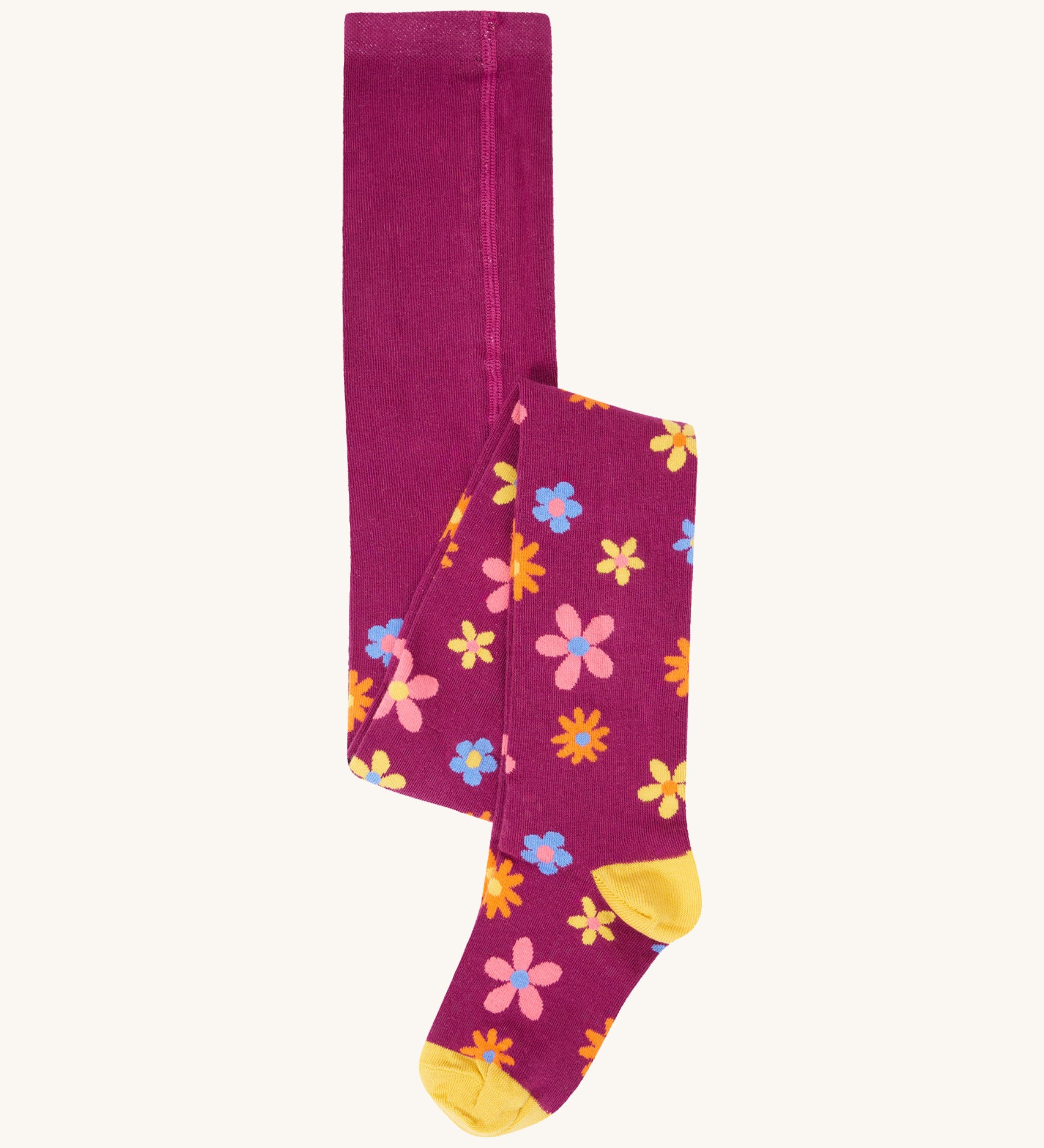 Frugi Norah tights in damson / retro floral available at Babipur. A GOTS organic cotton dark purple tights with a pastel coloured retro flower design and yellow contrasting panels