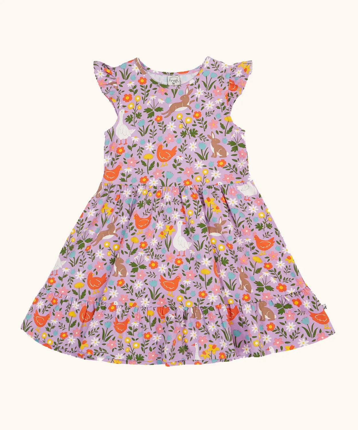 Frugi 100% organic cotton skater dress in violet purple with a repeating meadow inspired design. Shows a frill on the sleeves.