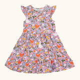 Frugi 100% organic cotton skater dress in violet purple with a repeating meadow inspired design. Shows a frill on the sleeves.