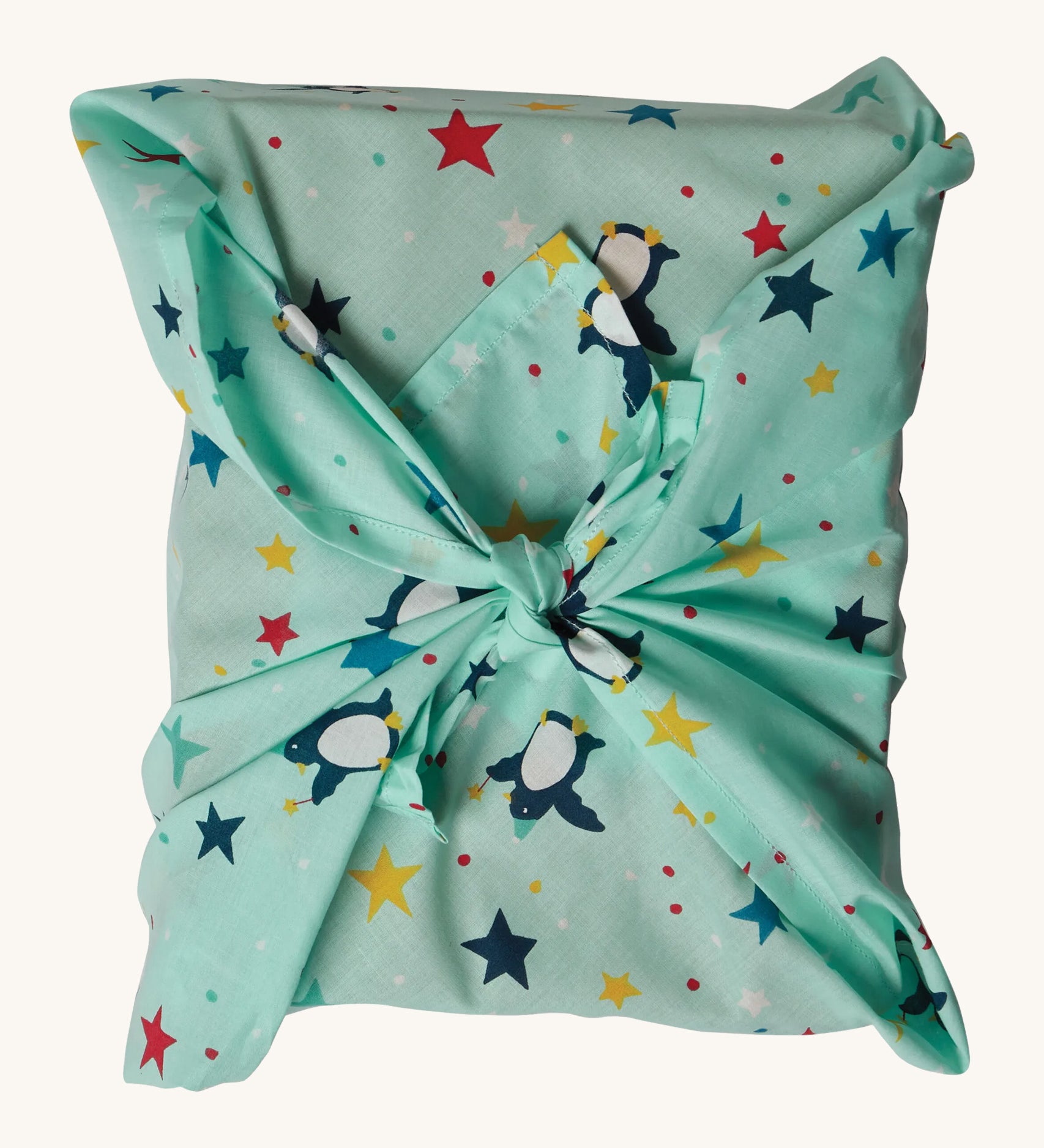 The Frugi GOTS-Certified organic cotton reusable gift wrap in Penguin Starry Sky design - a great eco-friendly alternative to wrapping paper 