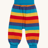 Frugi parsnip pants in big rainbow stripe available at Babipur. A GOTS organic cotton bottom in bold rainbow inspired striped design. Features blue elasticated cuffs