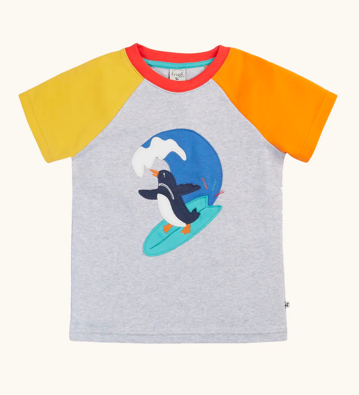 Frugi 100% organic cotton short sleeve t-shirt in grey with a yellow and orange sleeve. Showing a surfing penguin patch on the front