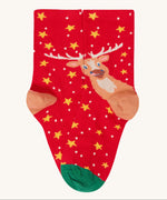 A close up of the red with yellow stars and reindeer stock from the Frugi rock my socks 3 in festive multipack available at Babipur. 