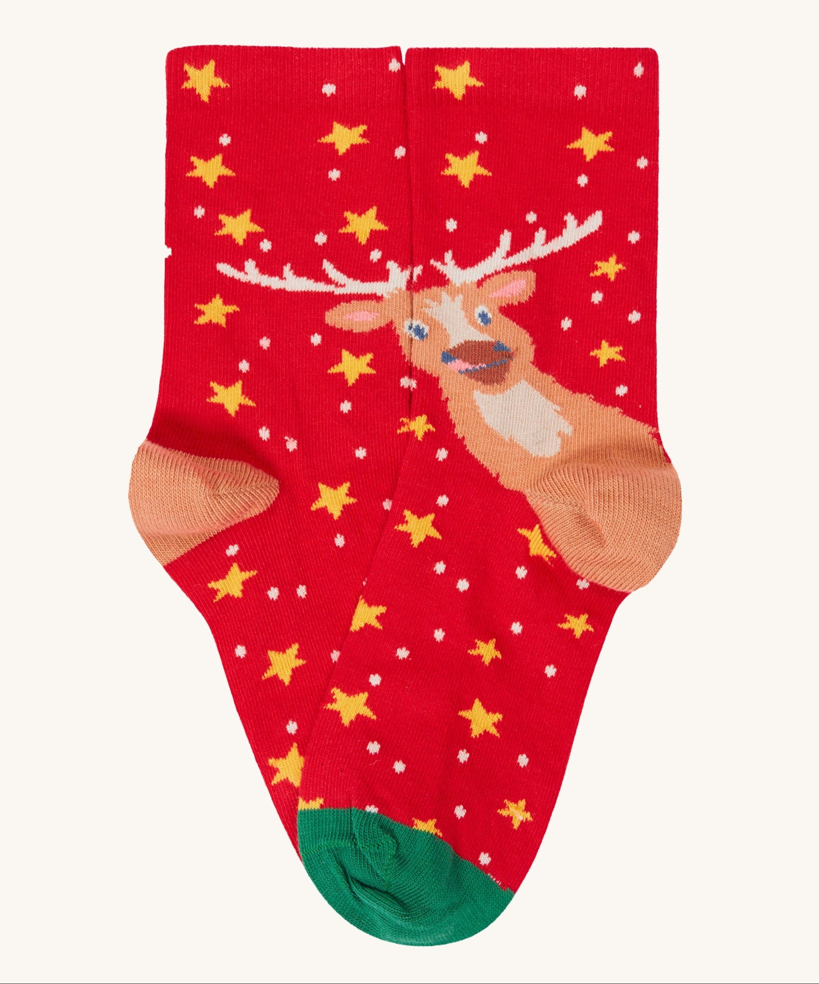 A close up of the red with yellow stars and reindeer stock from the Frugi rock my socks 3 in festive multipack available at Babipur. 
