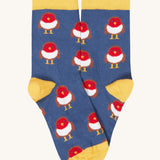 A close up of the blue and yellow with a cute robin design stock from the Frugi rock my socks 3 in festive multipack available at Babipur. 