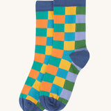 A close up of the autumn coloured inspired checkered design sock from the Frugi rock my socks 3 pack in stay wild available at Babipur. 