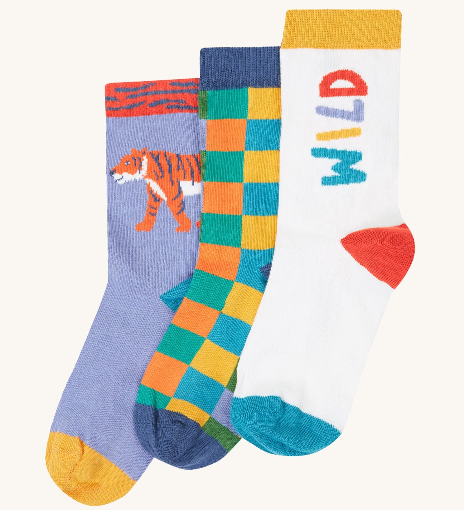 Frugi rock my socks 3 pack in stay wild multipack available at Babipur. GOTS organic cotton socks including a light purple with a tiger design, a checkered design and a white sock with stay wild slogan.